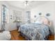Comfortable bedroom with hardwood floors, natural light, and decorative accents, creating a relaxing retreat at 9746 Sw 89Th Loop, Ocala, FL 34481