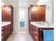 Bathroom featuring double sinks with a separate glass-enclosed shower at 9926 Sw 95Th Loop, Ocala, FL 34481