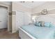 Comfortable bedroom with carpeting, soft lighting, and a large window overlooking the yard at 9926 Sw 95Th Loop, Ocala, FL 34481