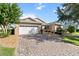 Inviting single-story home with a brick driveway, manicured lawn, and mature trees in a desirable location at 9926 Sw 95Th Loop, Ocala, FL 34481
