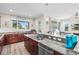 Spacious kitchen features a breakfast bar, sleek countertops, stainless appliances, and lots of natural light at 9926 Sw 95Th Loop, Ocala, FL 34481