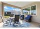 Inviting screened porch with stylish table and chairs and comfortable seating perfect for relaxing outdoors at 9926 Sw 95Th Loop, Ocala, FL 34481