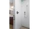 Bathroom showcasing the shower, with a white tiled wall and a glass enclosure at 9926 Sw 95Th Loop, Ocala, FL 34481