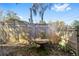 Backyard view of a wooden fence and a round table at 114 Ne 11Th Ave, Ocala, FL 34470