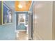 Bathroom view showcasing blue walls, white trim, and a decorative window at 114 Ne 11Th Ave, Ocala, FL 34470