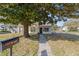 Charming home with a large shade tree, sidewalk and inviting curb appeal at 114 Ne 11Th Ave, Ocala, FL 34470