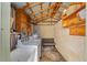 Functional laundry room with open shelving, washer, and utility sink for added convenience at 114 Ne 11Th Ave, Ocala, FL 34470