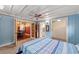 Bright bedroom with connecting doors to the bathroom and dining room at 114 Ne 11Th Ave, Ocala, FL 34470