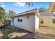 Back view of an outbuilding with white siding and a small window at 114 Ne 11Th Ave, Ocala, FL 34470