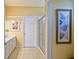 Bathroom featuring a glass enclosed shower, a door, and framed wall art at 13170 Se 92Nd Court Rd, Summerfield, FL 34491