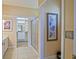 Bathroom featuring a glass enclosed shower and a glimpse into the walk-in closet at 13170 Se 92Nd Court Rd, Summerfield, FL 34491
