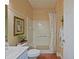 Cozy bathroom featuring a shower-tub combination, complemented by neutral tones and decorative accents at 13170 Se 92Nd Court Rd, Summerfield, FL 34491