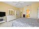 Bright bedroom with closet access and natural light, offering a view of the en-suite bathroom at 13170 Se 92Nd Court Rd, Summerfield, FL 34491