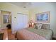 Comfortable bedroom featuring a bed, a closet, and ample natural light at 13170 Se 92Nd Court Rd, Summerfield, FL 34491