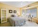 Inviting bedroom with a desk, storage, and natural light, designed for comfort and functionality at 13170 Se 92Nd Court Rd, Summerfield, FL 34491