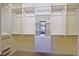 Large walk-in closet offering exceptional storage with adjustable shelving and drawers at 13170 Se 92Nd Court Rd, Summerfield, FL 34491