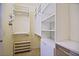 Spacious walk-in closet with custom white shelving and ample storage options at 13170 Se 92Nd Court Rd, Summerfield, FL 34491