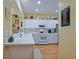 Well-lit kitchen featuring white cabinets and modern appliances at 13170 Se 92Nd Court Rd, Summerfield, FL 34491