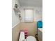 Bathroom with toilet, shelves, and sink offering a functional space at 15536 Se 203Rd Ave, Umatilla, FL 32784