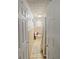 Functional bathroom featuring beige tile and decorative floral shower curtain at 15536 Se 203Rd Ave, Umatilla, FL 32784