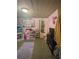bedroom featuring pink walls and fun, playful decor at 15536 Se 203Rd Ave, Umatilla, FL 32784