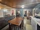 Open layout showcasing the living room, dining area, and kitchen, offering a connected living space at 15536 Se 203Rd Ave, Umatilla, FL 32784