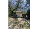 Backyard shed surrounded by nature providing additional storage space at 15536 Se 203Rd Ave, Umatilla, FL 32784