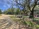 Fenced yard with a trampoline and recreational space offers outdoor enjoyment at 15536 Se 203Rd Ave, Umatilla, FL 32784
