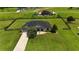 Expansive aerial view of a meticulously maintained home surrounded by lush green lawns at 1829 Nw 85Th Loop, Ocala, FL 34475