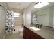 Bathroom with a large vanity, a large mirror, and a bathtub/shower combination at 1829 Nw 85Th Loop, Ocala, FL 34475