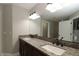 Bathroom vanity with double sinks and granite countertop at 1829 Nw 85Th Loop, Ocala, FL 34475