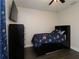 Bedroom featuring dark wood floors, TV, fan, and wardrobe at 1829 Nw 85Th Loop, Ocala, FL 34475