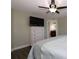 Bedroom view with a large television and a view to an attached bathroom at 1829 Nw 85Th Loop, Ocala, FL 34475