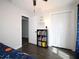Bedroom featuring closet, door, and books on a shelf at 1829 Nw 85Th Loop, Ocala, FL 34475