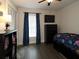 Bedroom with dark wood floors, a fan, window, and wardrobe at 1829 Nw 85Th Loop, Ocala, FL 34475