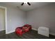 Bedroom with grey walls and dark vinyl wood floors at 1829 Nw 85Th Loop, Ocala, FL 34475