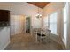 Charming dining area with vaulted ceilings, natural light, and easy access to the kitchen at 1829 Nw 85Th Loop, Ocala, FL 34475