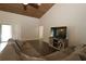 Comfortable living room featuring stylish decor, a large television, and natural lighting at 1829 Nw 85Th Loop, Ocala, FL 34475