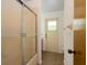 Bathroom showcasing a shower with sliding doors, and toilet at 205 Ne 53Rd St, Ocala, FL 34479