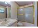 Bathroom featuring a shower with sliding doors and a vanity with a sink at 205 Ne 53Rd St, Ocala, FL 34479