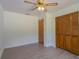 Bedroom highlighting hardwood floors, ceiling fan, and closet at 205 Ne 53Rd St, Ocala, FL 34479