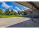 Exterior view of the backyard, storage shed and concrete patio at 205 Ne 53Rd St, Ocala, FL 34479