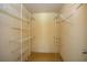 Walk-in closet featuring metal shelving and neutral carpet, perfect for organizing clothes and accessories at 205 Ne 53Rd St, Ocala, FL 34479