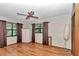 Spacious bedroom with hardwood floors and a large window offering plenty of natural light at 2676 Se 52Nd Ave, Ocala, FL 34480