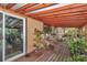 Outdoor deck featuring wood floors and plants, perfect for enjoying the outdoors at 2676 Se 52Nd Ave, Ocala, FL 34480