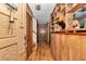 Inviting entryway featuring hardwood floors, wood paneled walls, and built in shelving for decor at 2676 Se 52Nd Ave, Ocala, FL 34480