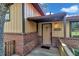 View of the front porch and front door with brick accents at 2676 Se 52Nd Ave, Ocala, FL 34480
