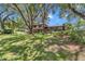 Wide aerial shot of the front yard, mature trees and landscaping at 2676 Se 52Nd Ave, Ocala, FL 34480