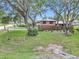 Wide aerial shot of the front yard, mature trees and landscaping at 2676 Se 52Nd Ave, Ocala, FL 34480