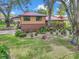 Aerial view of the home showing the front yard, landscaping, and mature trees at 2676 Se 52Nd Ave, Ocala, FL 34480